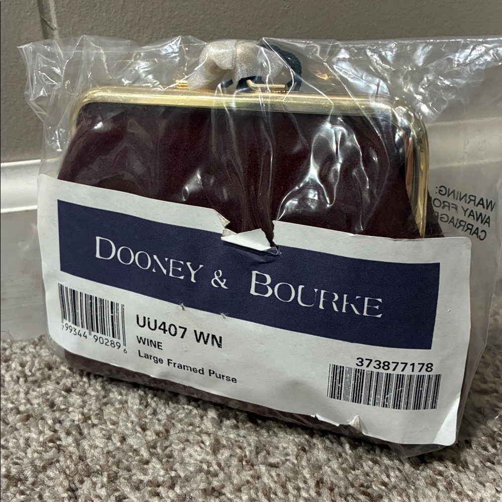 Dooney & Bourke Suede Framed Clutch in the color wine